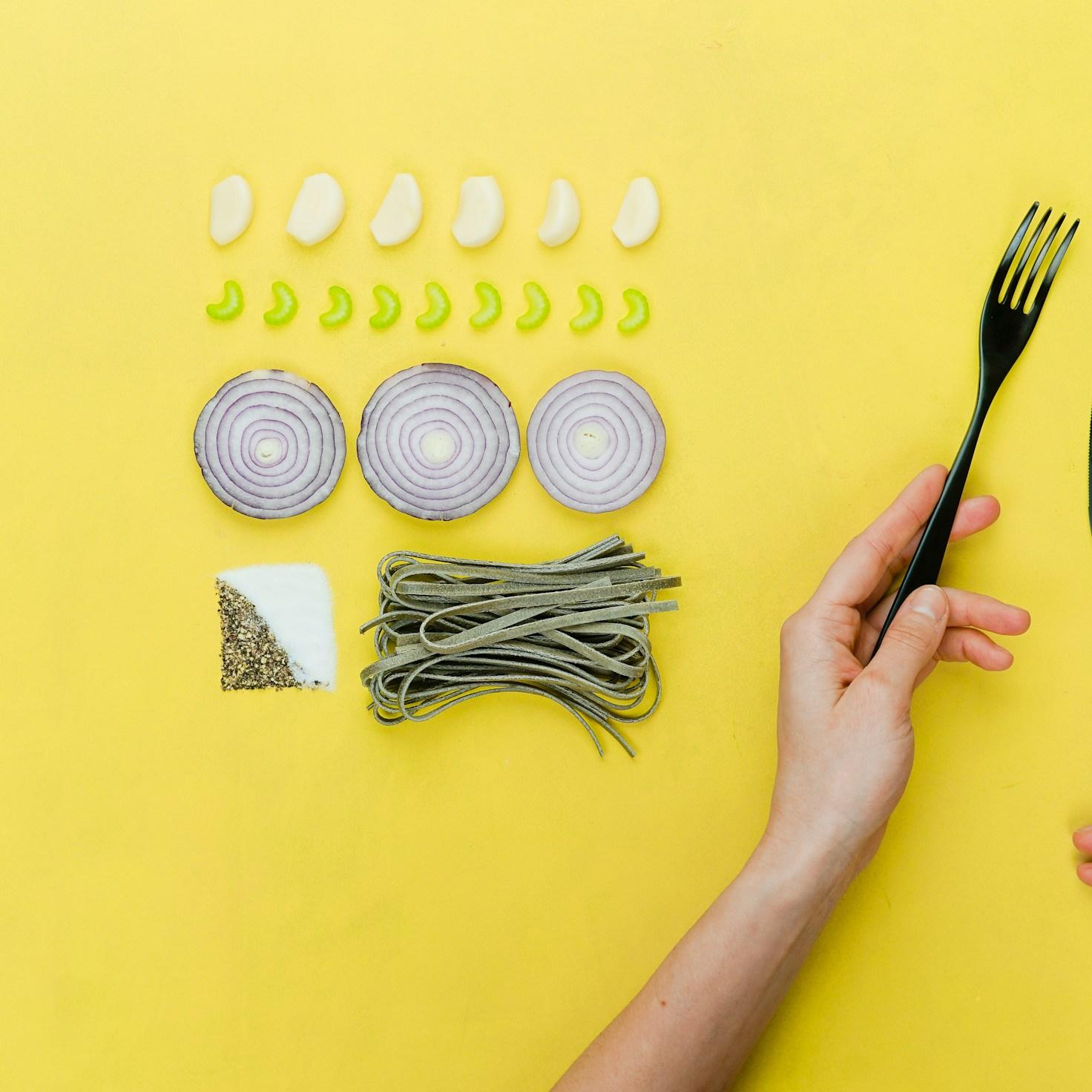 Community members collaborating in a contemporary kitchen, exchanging recipes and cooking techniques